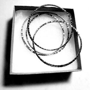 Set of 4 Silver Hammered Bangles New Condition